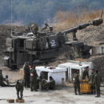 Israeli-soldiers-stand-next-to-an-artillery-unit-on-the-Israeli-side-of-the-border-with-Lebanon-1024×683-1